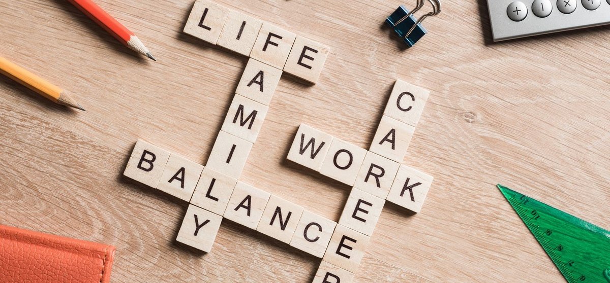 Words work life balance and family on table collected with wooden cubes